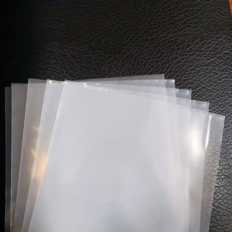 Stack of vinyl records protected in clear outer sleeves